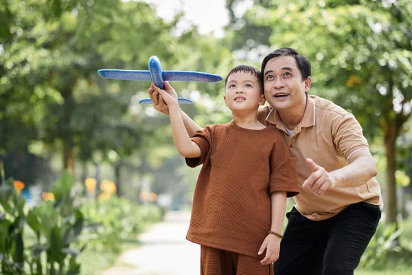 Excited Grandfather Grandson Playing Toy Plane Together — Stock Photo, Image