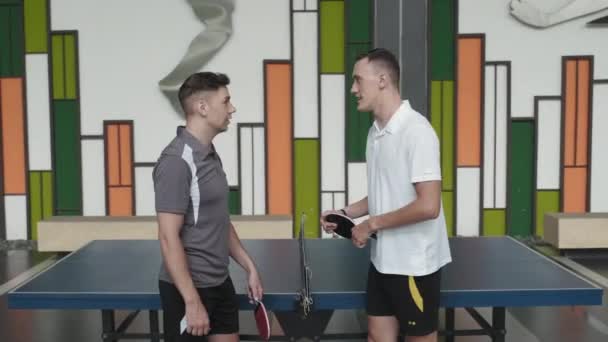 Two Cheerful Friends Sportswear Chatting High Fiving Playing Table Tennis — Video