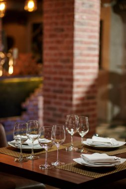 Restaurant table served for three people for fine dining