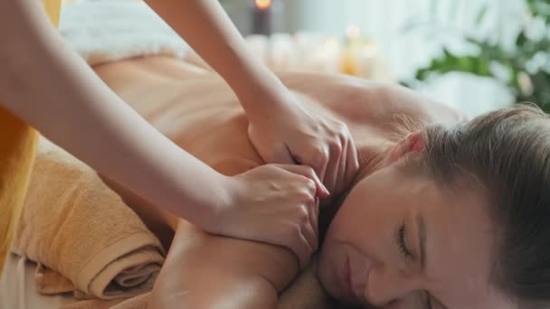 Relaxed Young Caucasian Woman Getting Back Massage Bright Luxury Spa — Stock Video