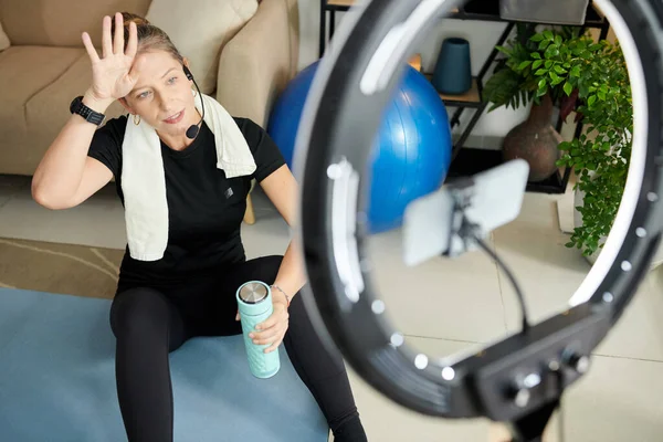 Tired Online Fitness Instructor Drinking Water Filming Intense Training — Foto Stock