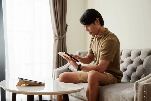 Serious Freelancer Sitting Sofa Home Reading Mail Digital Tablet — Stockfoto
