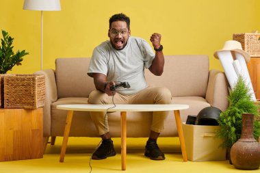 Emotional excited man winning videogame and making fist bump gesture