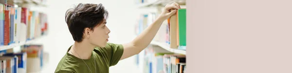 Banner College Student Taking Book Shelf Library — Stok fotoğraf