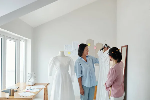 Tailor Showing Finished Wedding Dress Client — Stock Photo, Image