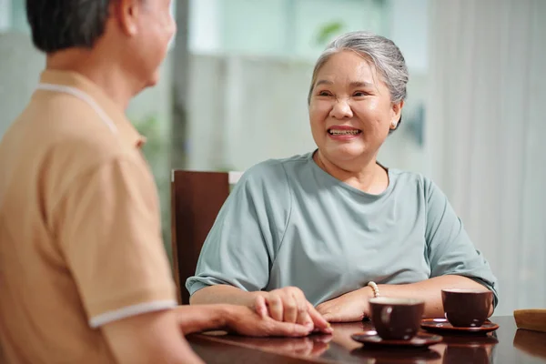 Cheerful Senior Couple Having Tea Discussing News — Stock Photo, Image