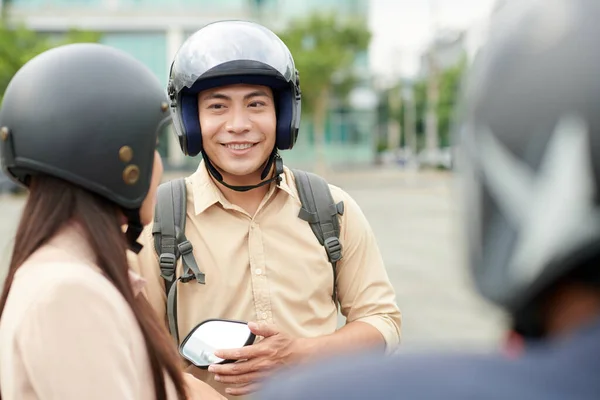 Cheerful Young Man Wearing Protective Helmet Talking Friends — Stock Photo, Image