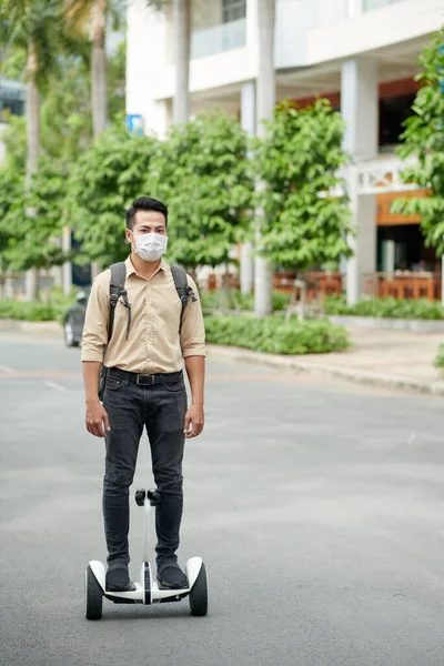 Young Man Medical Mask Riding Campus Two Wheeled Personal Transporter — Stock Photo, Image