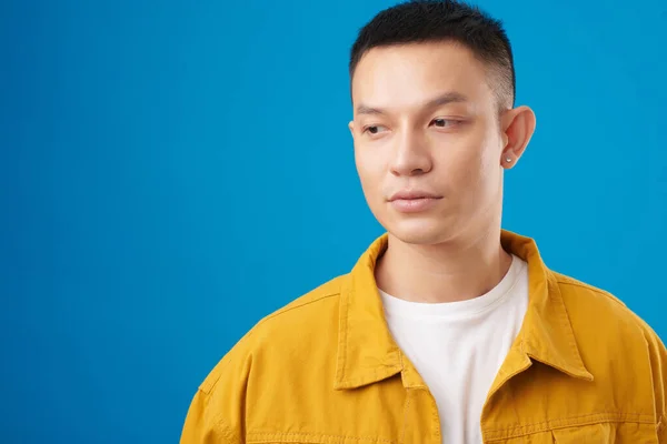 Portrait Pensive Young Vietnamese Man Denim Jacket Isolated Blue — Stock Photo, Image