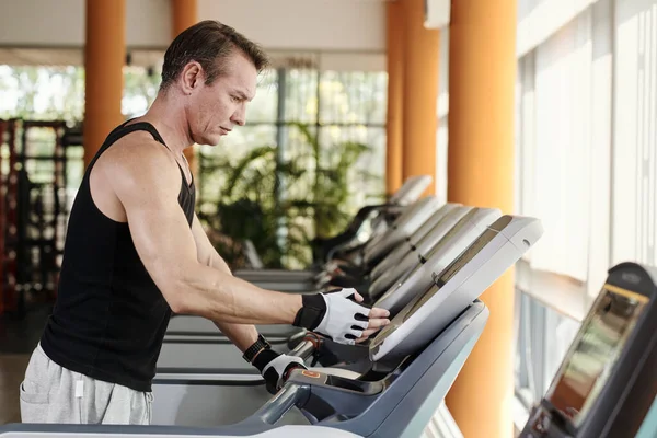 Man Increasing Speed Treadmill Warming Out Gym — Stock Photo, Image