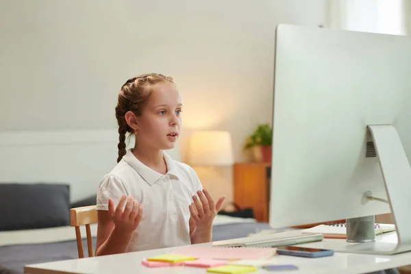 Schoolgirl Speaking Front Computer Attending Online Class — Stock Photo, Image