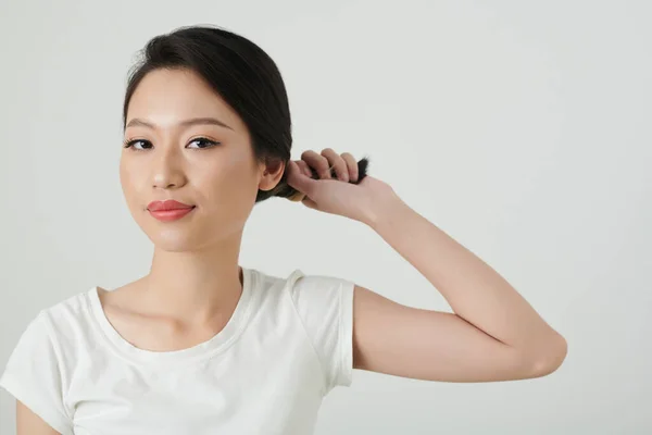 Portrait Smiling Young Woman Twisting Hair Making Elegant Bun — Stock Photo, Image