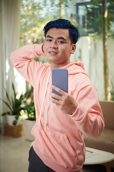 Smiling Young Man Salmon Color Hoodie Posing Selfie — Stock Photo, Image
