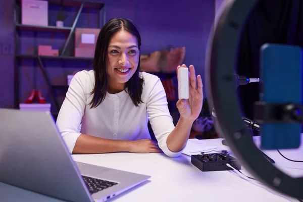 Stock image Joyful young woman filming review of new small device for blog