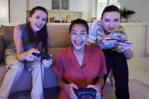 Portrait Happy Friends Holding Joysticks Playing Video Game Together Home — Stock Photo, Image