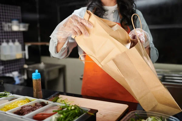Cropped Shot Gloved Female Clerk Uniform Putting Sack Takeaway Food — Stock Photo, Image