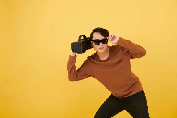 Studio Portrait Young Man Speaker Hand Adjusting Sunglasses Looking Camera — Stock Photo, Image