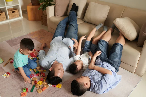 Happy Father His Three Sons Spending Time Lying Floor Home — Stock Photo, Image