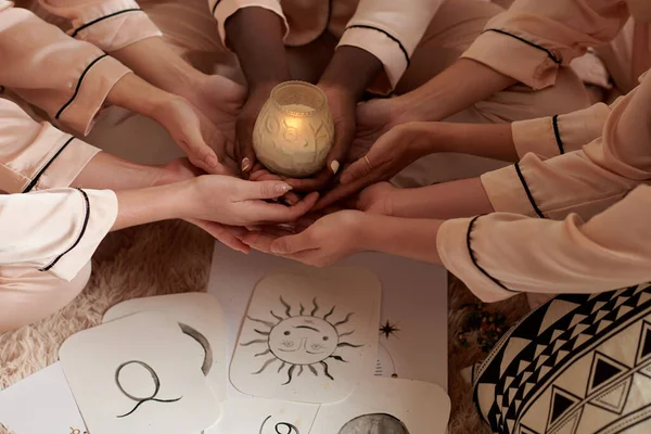 Hands Friends Holding Burning Candle Paper Cards Hand Drawn Zodiac — Stock Photo, Image