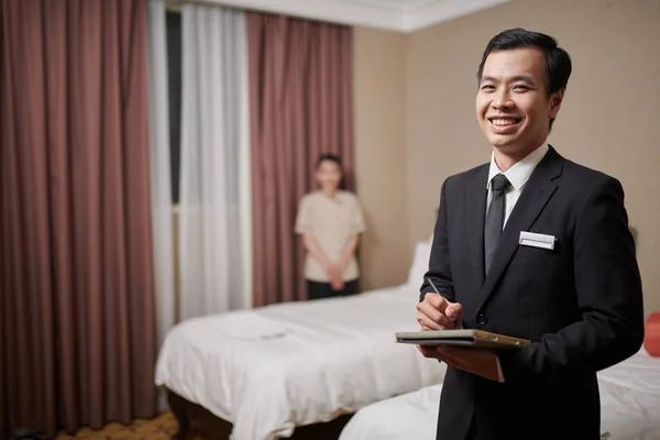 Cheeful Fancy Hotel Manager Filling Form Tablet Computer Maid Making — Stock Photo, Image