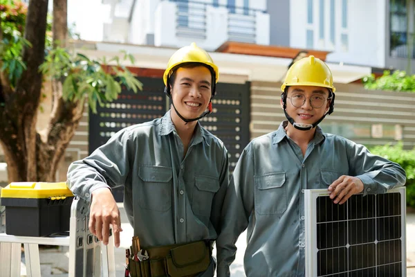 Cheerful Vietnamese Solar Panel Installers Wearing Hard Hats — Stock Photo, Image
