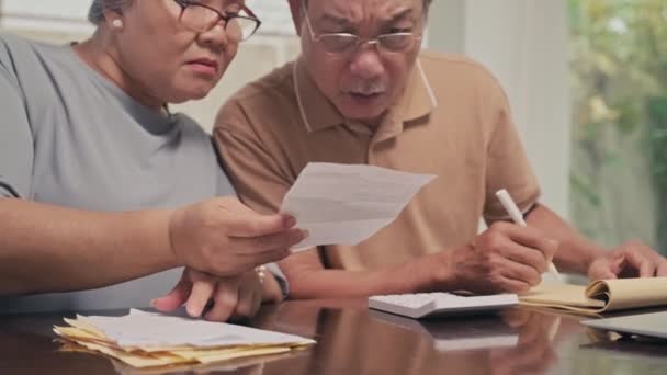 Cropped Image Senior Couple Calculating Sum Utility Bills Sitting Table — Stock Video