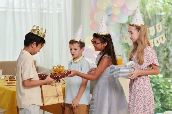 Happy Kid Wearing Paper Crown Accepting Birthday Presents Friends — Stock Photo, Image