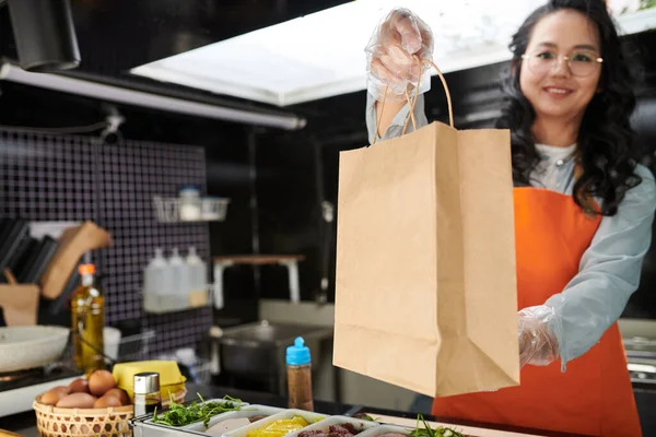 Smiling Food Truck Worker Giving Paper Bag Order Looking Camera — Stock Photo, Image