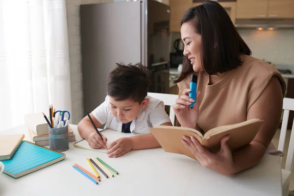 Smiling Mother Helping Son Doing Homework School — Stock Photo, Image