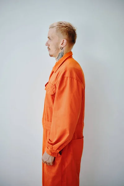 Profile Portrait Arrested Young Man Orange Jail Uniform — Stock Photo, Image