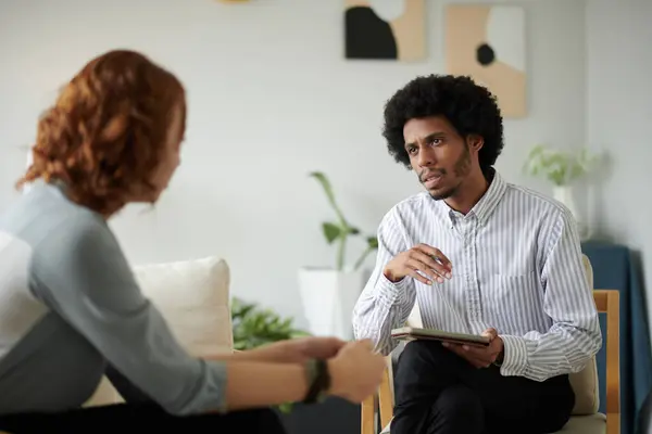 Therapist asking client to tell more about her childhood