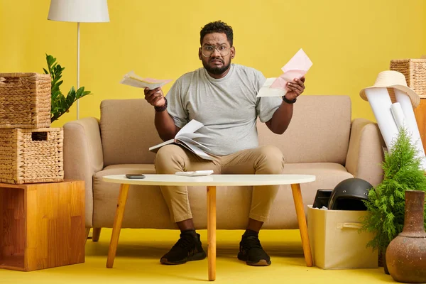 stock image Unhappy man unable to manage personal finances and pay bills and loan