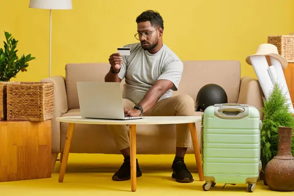 stock image Man booking flight and hotel and paying with credit card