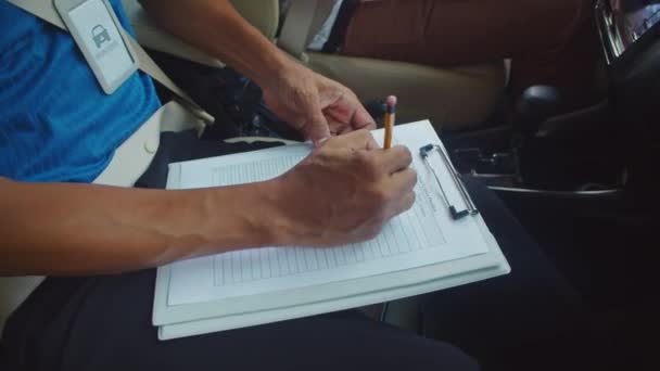 Cropped Shot Driving School Teacher Making Notes Report Card His — Stock Video