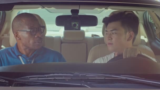 Portrait Positive Black Male Driving Instructor Asian Student Looking Camera — Stock Video
