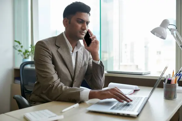 Portrait Serious Indian Entrepreneur Talking Phone Checking Mails Documents Laptop — Stock Photo, Image