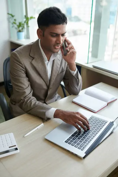 Young Indian Businessman Talking Phone Client Checking Agreement Laptop Screen — Stock Photo, Image