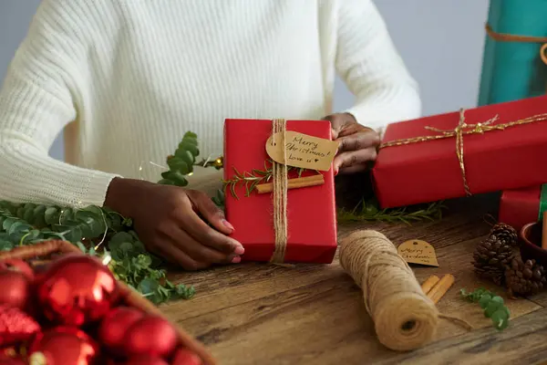 Black Woman Showing Decorated Christmas Presents Wrapped Red Paper — Stock Photo, Image