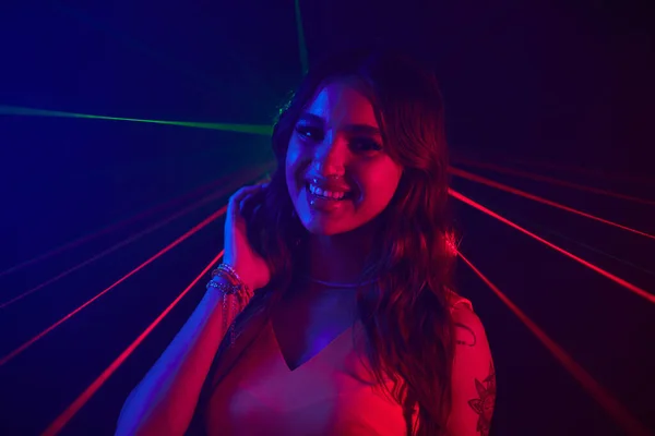 Portrait Smiling Young Woman Dancing Neon Lights Night Club — Stock Photo, Image