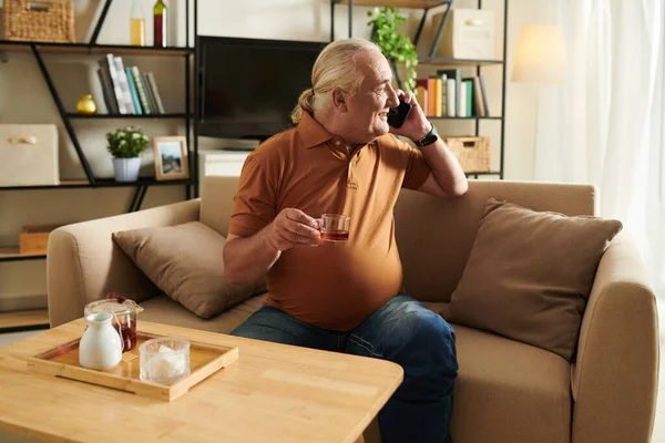 Cheerful Aged Man Talking Phone Friend Drinking Tea Home — Stock Photo, Image