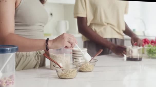 Tilt Shot Biracial Female Friends Cooking Breakfast Cereal Kitchen — Stock Video