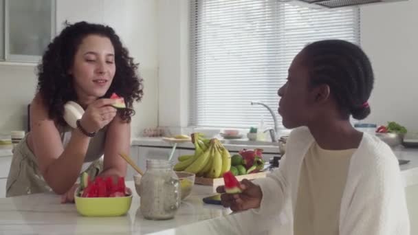 Medium Shot Young Woman Mixed Ethnicity Eating Fresh Watermelon Communicating — Stock Video