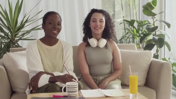 Medium Portrait Biracial Female Roommates Smiling Camera While Studying Remotely — Stock Video