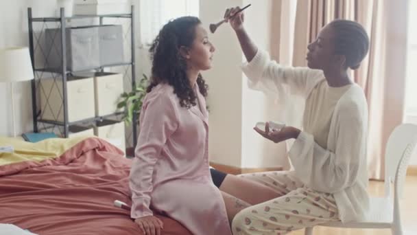 Medium Long Shot Black Girl Doing Makeup Her Friend Sitting — Stock Video