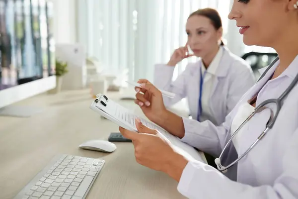 Female Medical Workers Sitting Desk Discussing Advantages New Medication — Stock Photo, Image