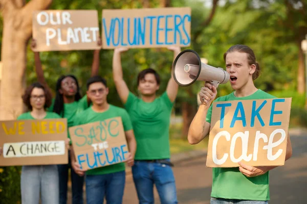 Group of activists encouraging others to be volunteers and care more about nature