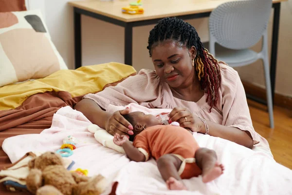 Smiling Black Woman Giving Pacifier Her Newborn Baby Girl — Stock Photo, Image