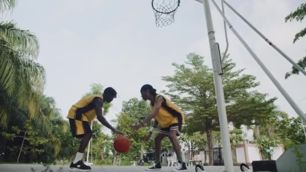 Low Angle Slowmo Sportsman Practicing Ball Steal While Playing Streetball — Stock Video