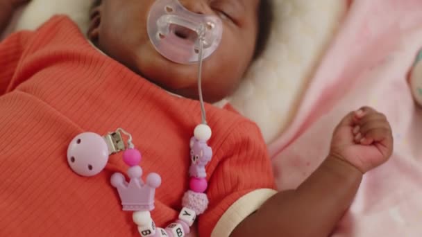 Tilt Adorable Infant African American Ethnicity Pacifier Taking Nap Bed — Stock Video