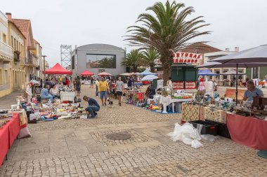 Torreira Aveiro Portugal - 08 07 2022 : View of the market and fair Antiques, Souvenirs and Handicrafts Fair, selling antiques and second-hand items, in Varinas square, former fish sellers, on Torreira beach